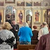 A view similar to that of the previous photo except the photo shows a wider view, with more congregants, who are now standing. Fr. Aleksey is also in background of this photo. He's standing, facing the Royal Doors, which are now closed.