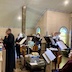 View of choir members singing during the service. The photo was taken from the choir loft.